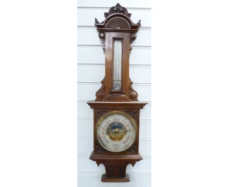 Late 19thC / early 20thC wall aneroid barometer / thermometer combination in carved wooden case, 93cm tall