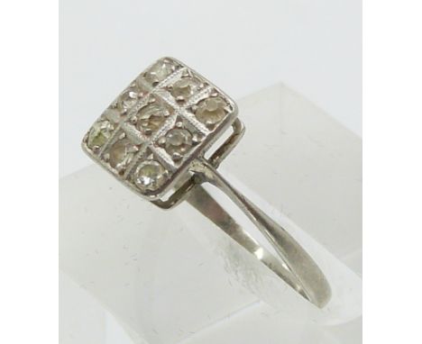 A platinum ring set with nine old cut diamonds in a square setting (size K/L)