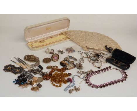 A collection of costume jewellery including brooches, filigree brooch, glasses, pocket watch face, paste buckles, cufflinks, 