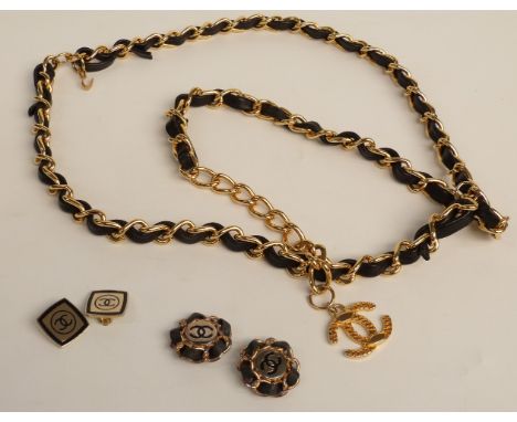A gold tone Chanel belt with black leather detail with two pairs of Chanel earrings&nbsp;