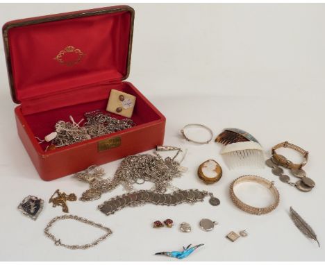 A 9ct gold crucifix, large quantity of silver chains, silver brooch set with enamel, etc&nbsp;