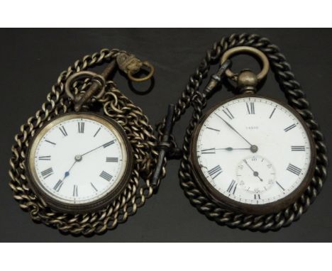 Two silver open faced pocket watches both with blued hands, Roman numerals and white enamel dials, one with inset subsidiary 