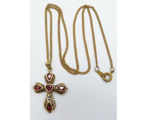 A 9ct gold necklace and a 9ct gold cross set with garnets, 4.3g