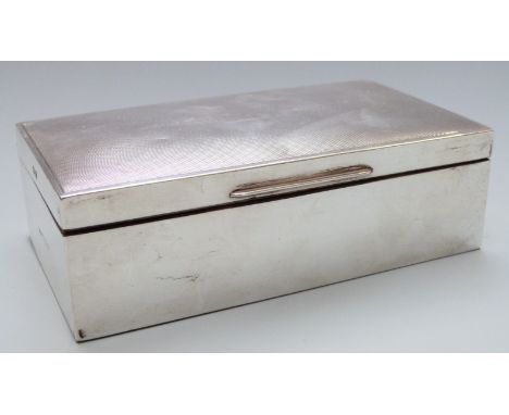Elizabeth II hallmarked silver cigarette box with engine turned lid, London 1952 maker Harman Brothers, width 16cm