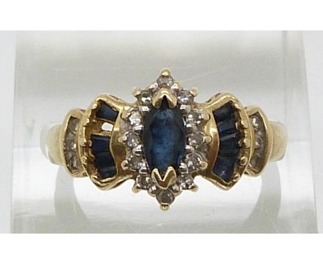 A 14ct gold diamond ring set with a marquise cut sapphire and diamonds (size M)