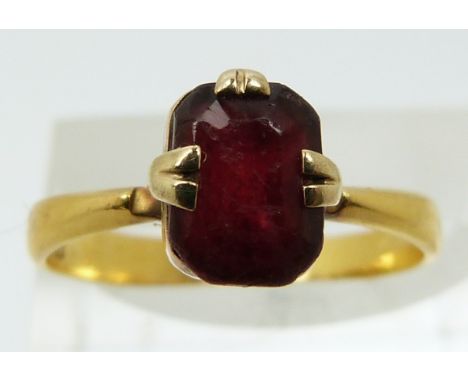 A 22ct gold ring set with paste