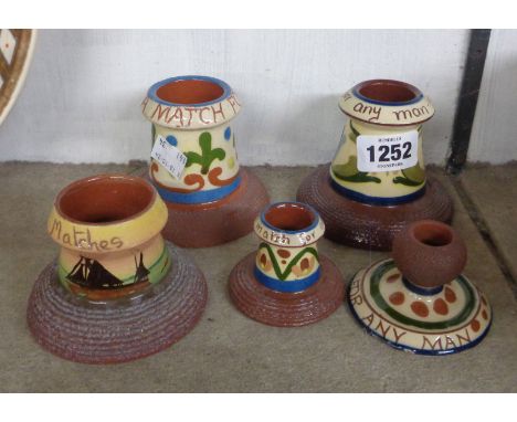 Five Torquay Pottery match strikers with various patterns including scandy and sailing boats - various makers including Watco