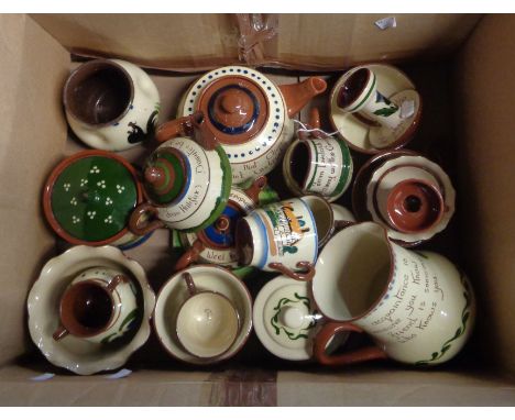 A box containing a quantity of Torquay pottery including jugs, teapots, vases, bowls, etc. - various decoration including coc