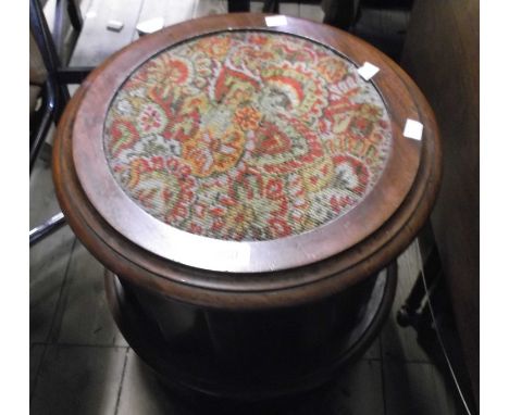 A Victorian mahogany pedestal step commode with upholstered seat, fluted sides and containing a Coalport 'Strange Orchid' pat