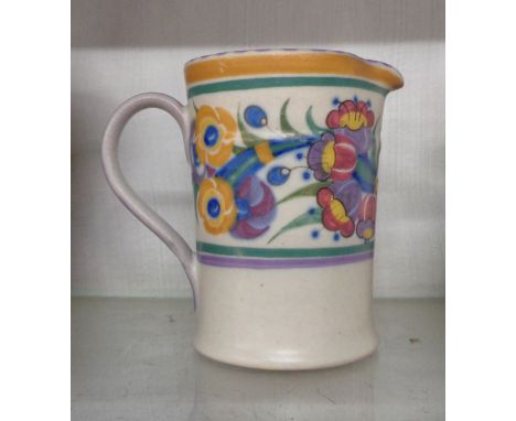 A 1930's Art Deco Poole Pottery jug with hand painted stylised floral decoration on white glazed ground