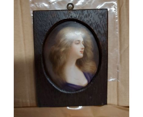 A wooden framed portrait miniature on domed ceramic panel in the Berlin style, depicting a young woman with flowing hair - 8c