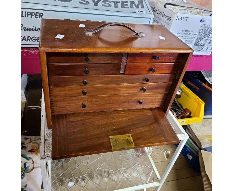 A 42cm vintage stained wood engineer's tool chest with four short and three long graduated drawers enclosed by a slide front 
