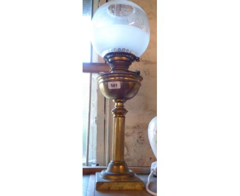 A Hinks &amp; Co brass oil lamp of pillar form with chimney and later etched shade