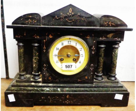 A late Victorian black slate cased mantel clock of architectural design with dial marked for Russells Ltd., Liverpool, with F