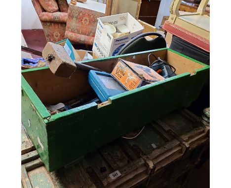A wooden box containing a quantity of tools including jigsaw, plane, clamps, etc.