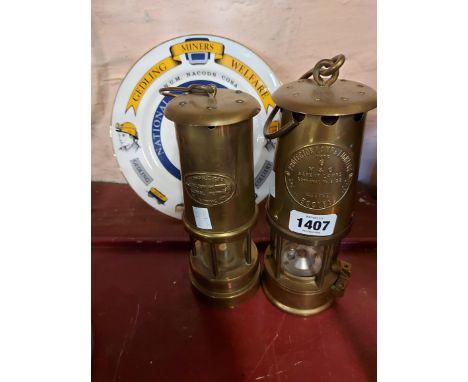 A Ferndale Colliery miner's lamp and an Eccles type 6 similar - sold with a commemorative 'Gedling Miners Welfare' ceramic pl