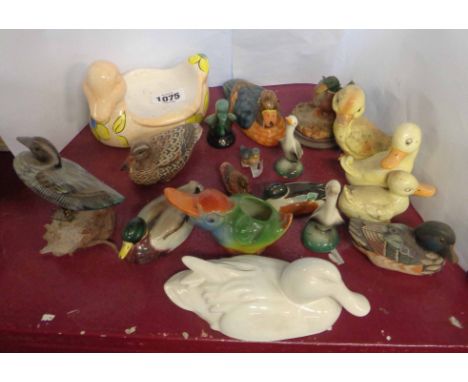 A quantity of ceramic and resin duck figurines including Beswick, Wade, etc. - various condition