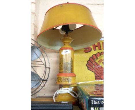 A vintage Toleware lamp with printed decoration - sold with original shade