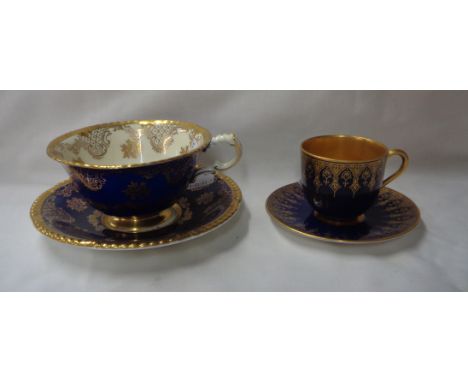 A Royal Worcester bone china demitasse coffee cup and saucer with gilt decoration on a blue glazed ground - date code 1921 - 
