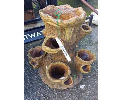 A salt glazed strawberry planter of trunk form