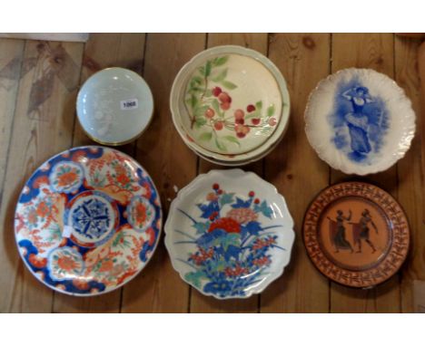 A Japanese Imari charger with typical decoration, a Japanese porcelain plate and a quantity of ceramic plates and dishes