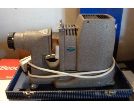 A boxed slide projector - sold with another similar