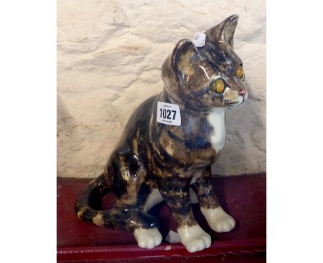 A Winstanley pottery figurine, depicting a seated tabby cat, with hand painted finish