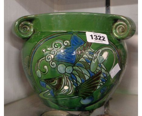 An early 20th Century C.H. Brannam Barnstaple Art Pottery jardinière with Art Nouveau fish decoration on a green glazed groun