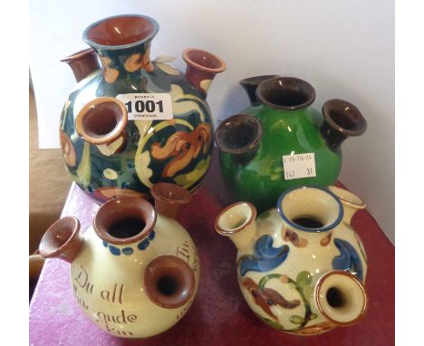 Four Torquay pottery tulip vases of various size and decoration including scandy and mottoware examples - various maker inclu