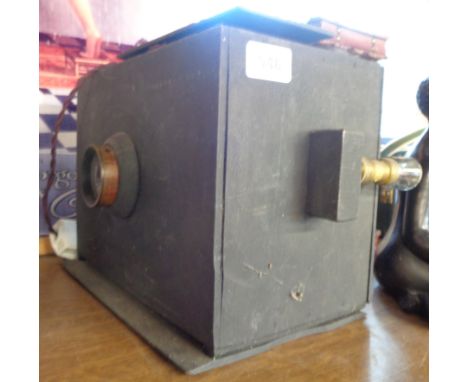 A vintage black painted wood cased projector