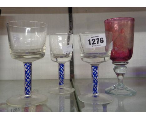 Three vintage drinking glasses with blue enamel twist stems - sold with another drinking glass with internal aventurine decor