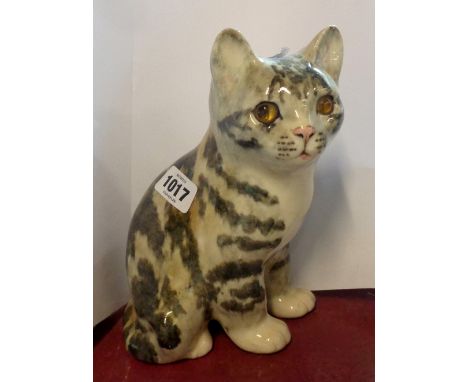 A Winstanley Pottery figurine, depicting a seated tabby cat, with hand painted finish