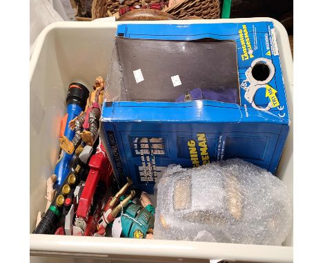 A crate containing a quantity of vintage toys including Power Ranger figures, a laughing policemen automaton, etc.