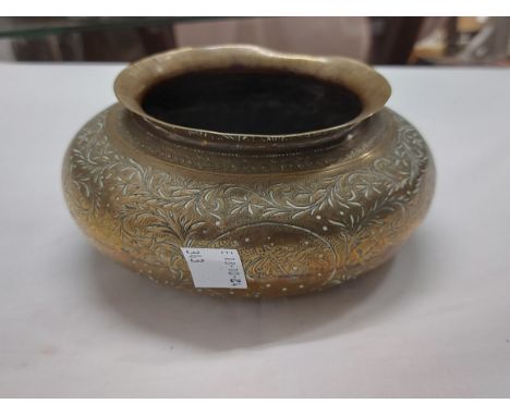 An old Indian chased brass pot decorated with four medallions, depicting dancing figures - sold with a decorative brass inkwe