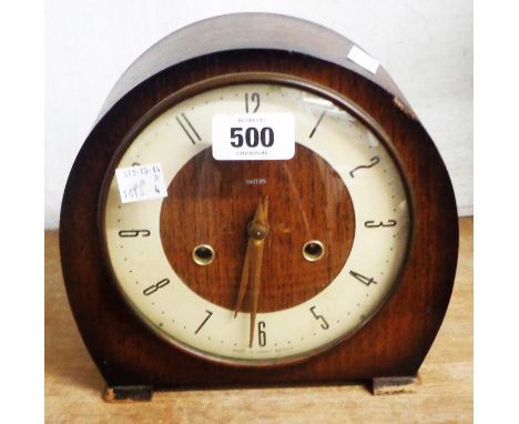 A vintage Smiths oak cased mantel clock with eight day gong striking movement