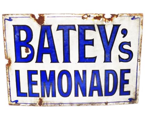 An early 20th Century enamel sign for 'Batey's Lemonade' with blue lettering on a white ground and whiplash border