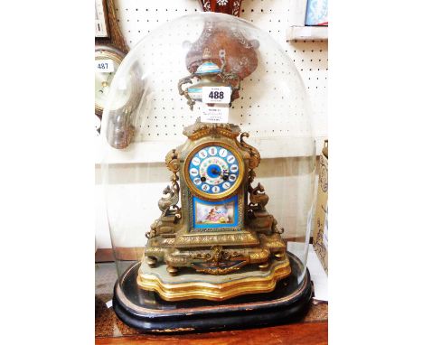 A 19th Century French ornate gilt spelter cased salon clock with urn finial and inset Sevres style painted porcelain panels a