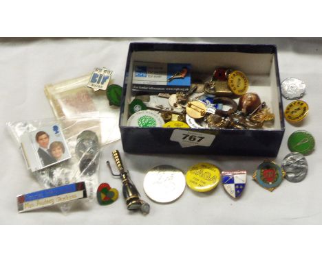 A small box containing a quantity of enamel and tin badges including ice hockey clubs, etc. - sold with an old ten shilling n