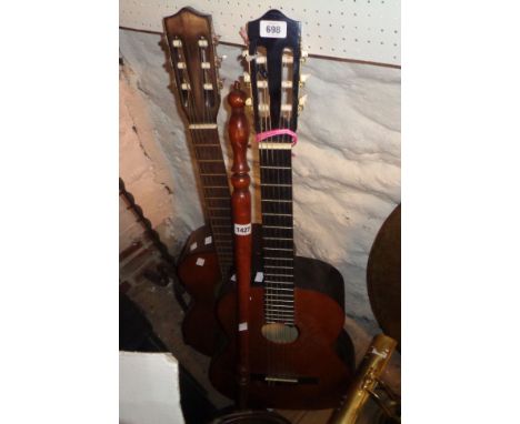 A Stagg acoustic guitar and a Minnaco acoustic guitar