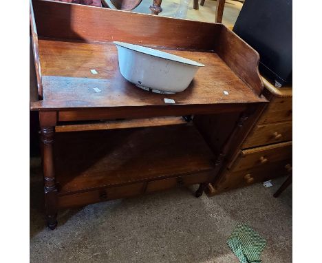 A 91cm Victorian mahogany washstand with galleried top and two drawers to undertier, set on turned supports - associated enam