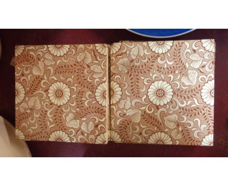 Eleven late 19th Century Mintons ceramic tiles, decorated with a brown floral transfer printed pattern in the Aesthetic Movem