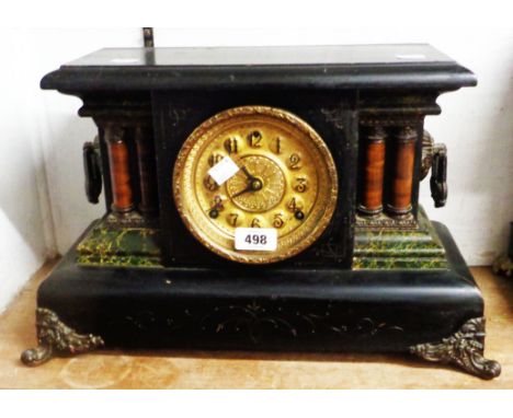 A late 19th Century simulated black slate and brass mounted cased mantel clock with American spring drive bell and gong strik