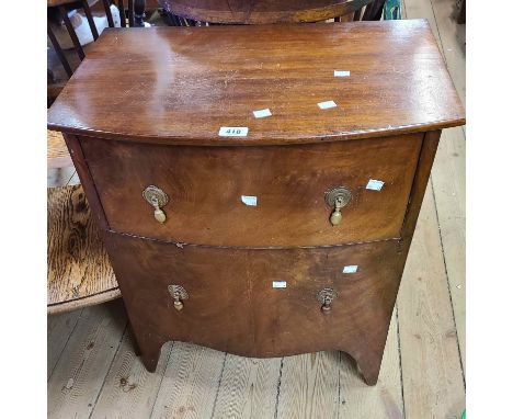 A 19th Century mahogany bow front commode chest with single deep frieze drawer and dummy cupboard under, set on swept legs