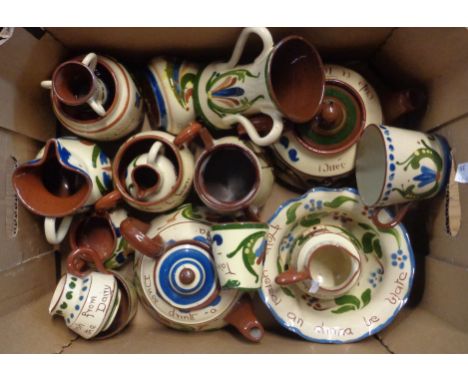 A box containing a quantity of Torquay pottery including teapots, jugs, bowls, etc. - various decoration including scandy, mo