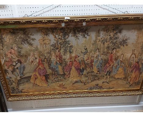 A large gilt framed panoramic Belgian machine tapestry panel, depicting a social gathering