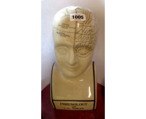 A modern ceramic phrenology head with crackle glaze finish