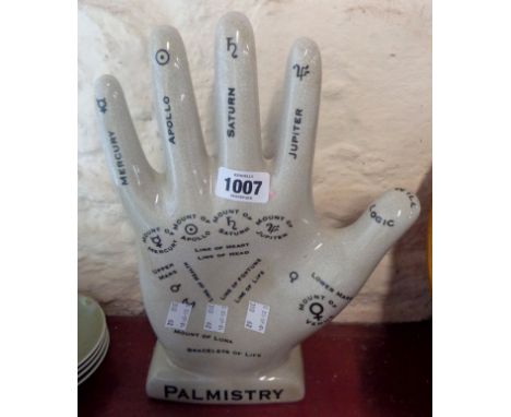A modern ceramic palmistry hand with crackle glaze finish