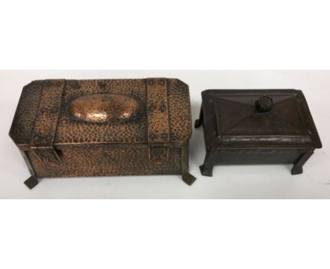 An Arts &amp; Crafts copper and brass mounted hinge-lidded tea caddy of square tapering form with domed decoration to the top