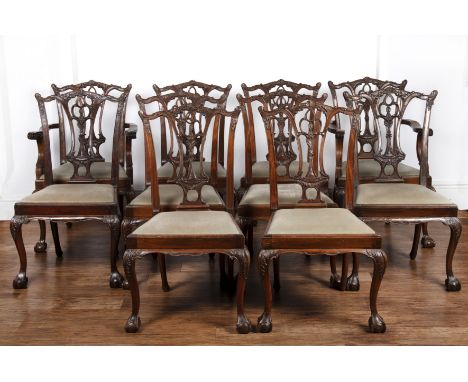 Set of ten Chippendale style mahogany dining chairs with carved decoration and pierced vase splat backs, standing on ball and