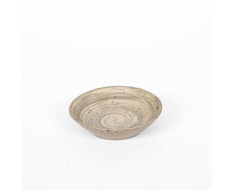 ARR Bernard Leach (1887-1929) a studio pottery dish in grey and cream glazes, impressed seal mark to base, 16cm diameterA ver